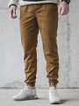 spodnie-materialowe-jogger-laur-icon-karmelowe-biale (1).jpg