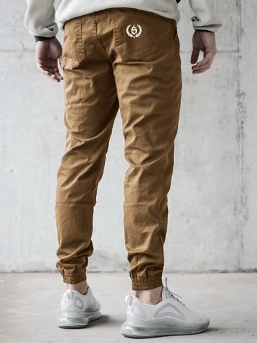 spodnie-materialowe-jogger-laur-icon-karmelowe-biale.jpg