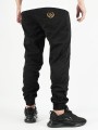 spodnie-materialowe-jogger-laur-icon-czarne-zlote.jpg